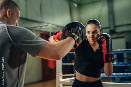 A female fighter practices her punch © cherryandbees