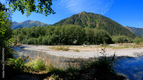 small clear cold river with boulder stones in Arkhyz mountains - photo of nature