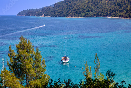 Fototapeta Naklejka Na Ścianę i Meble -  Sailing ship in the aegean sea near beautiful Fava sand beach near Vourvourou, Greek peninsula Sithonia, Chalkidiki