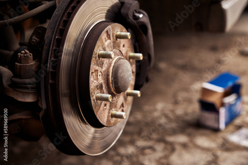 Rusty car brake rotor in automobile warckshop