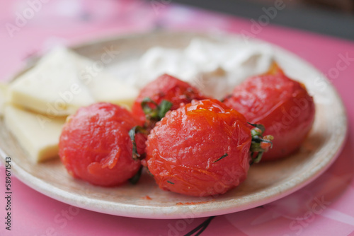 baked tomato and capsicum on plate 