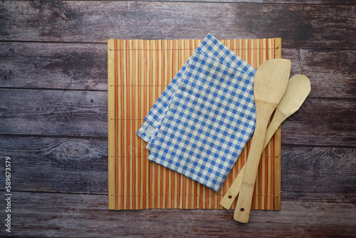 blue color table napkin on wooden table 