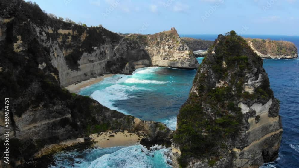 drone fly over beautiful diamond beach in Nusa Penida drone fly over beautiful diamond beach in Nusa Penida