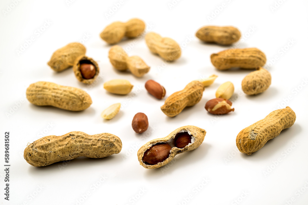 Dried peanuts in closeup on white Dried peanuts in closeup on white