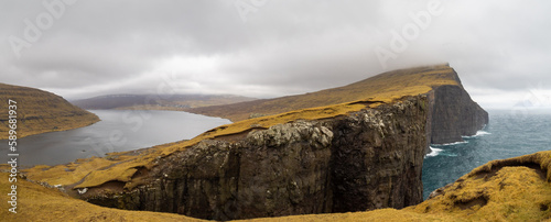 Leitisvatn lake over the ocean cliffs seen from Trælanípa photo