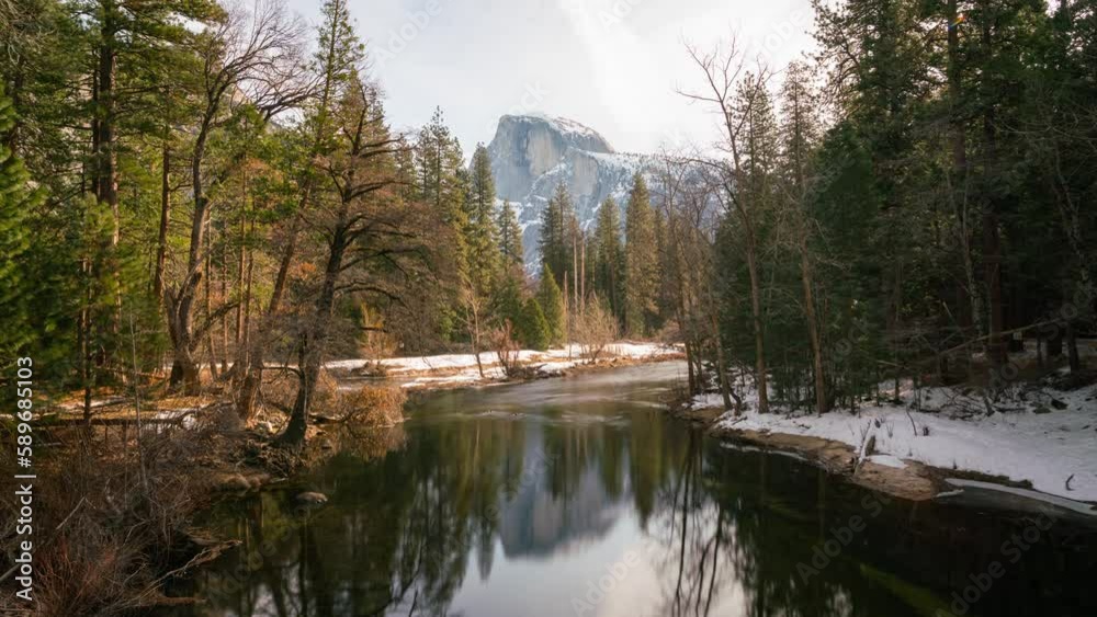 Time lapse long exposure of Half Dome reflected in Merced River in Yosemite National Park in California, USA Time lapse long exposure of Half Dome reflected in Merced River in Yosemite National Park in California, USA