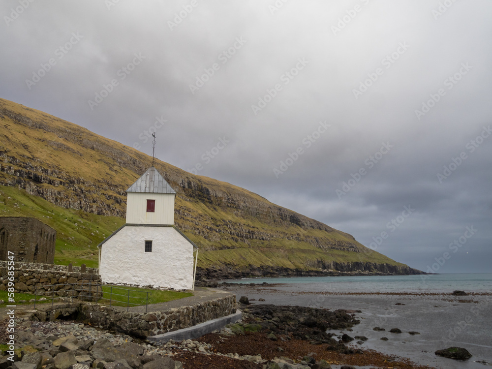 Ólavskirkjan church, the oldest in the Faroe Islands, by the seaside at Kirkjubøur