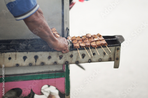 Street food originating from Indonesia is called pentol tofu grilled with spicy sauce. It has a nice and delicious taste photo