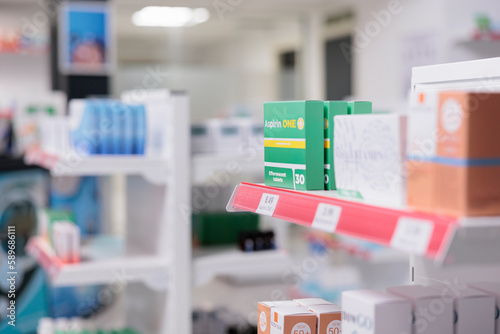 Fototapeta Naklejka Na Ścianę i Meble -  Healthcare retail store with pharmaceutical products and drugs packages on shelves, medicaments boxes and vitamins bottles. Empty pharmacy shop filled with supplements and pharmaceutics capsule