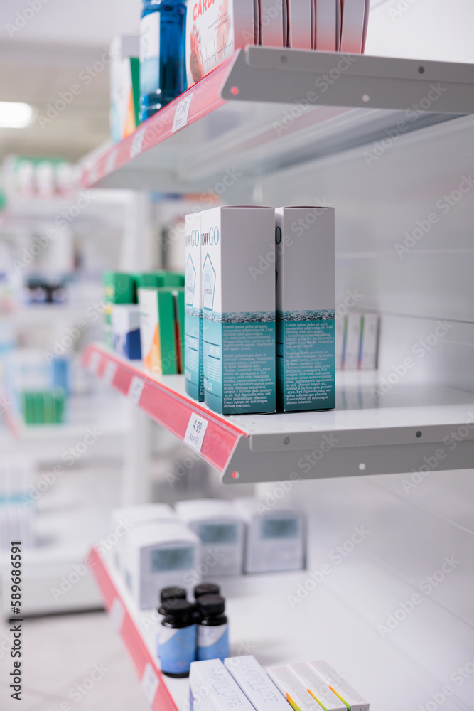 Selective focus of drugstore shelves filled with vitamins and pharmaceutical products to sell prescription medicine or treatment to customers. Empty pharmacy with medication and pills bottles.