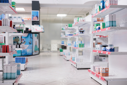 Empty drugstore with nobody in it equipped with pharmaceutical products, health care products, vitamins. Pharmacy desk full with medical prescription of clients. Medicine support services