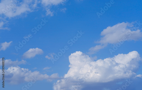 Fototapeta Naklejka Na Ścianę i Meble -  background light sky gradient, close-up of beautiful white fluffy clouds in blue sky, concept of lightness, elevation, heavenly space, the abode of God, natural basis for the designer