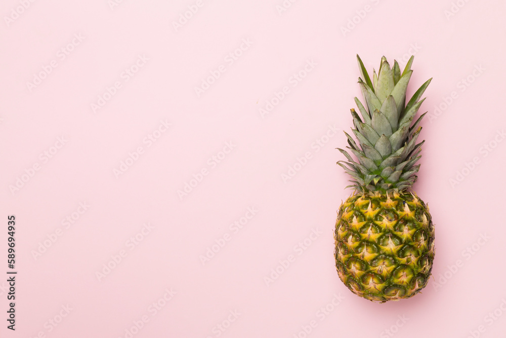 Fresh pineapple on color background, top view Fresh pineapple on color background, top view