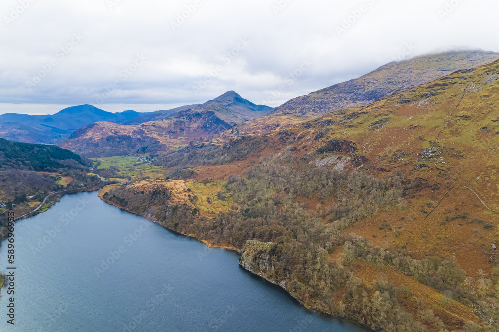 amazing landscape of Snowdonia from the sky, cloudy day, blue lake, Wales. High quality photo