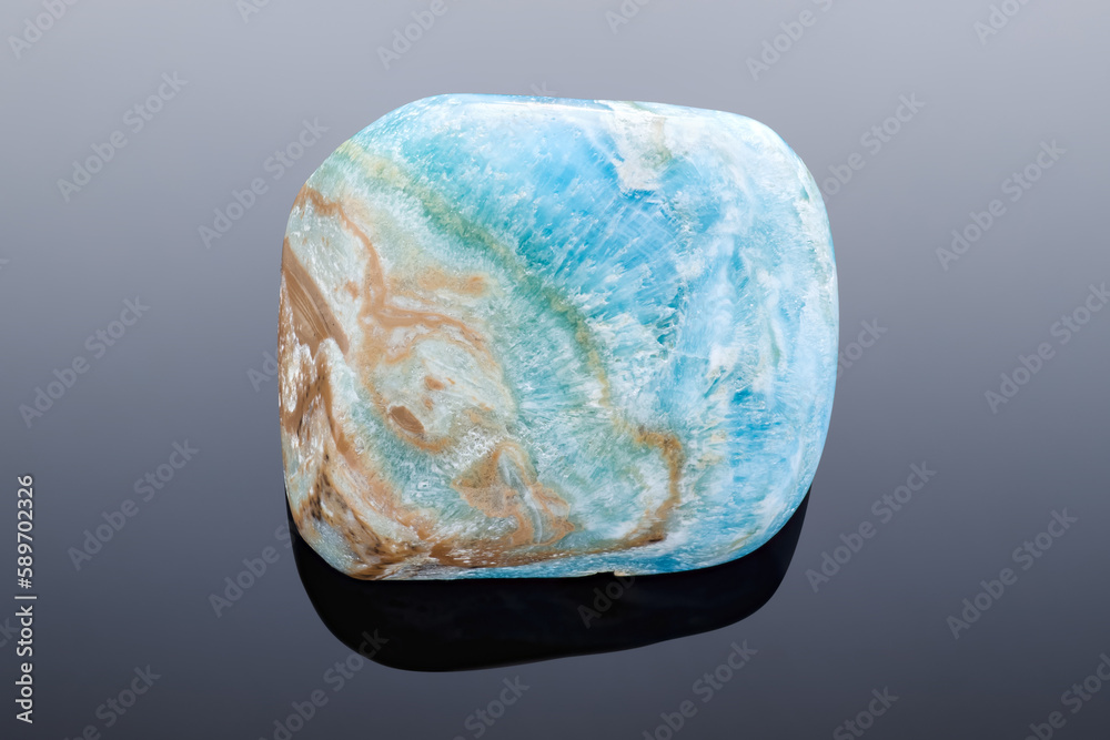 Caribbean Calcite tumblestone - Very sharp and detailed photo of this beautiful stone that can only be found in Pakistan. It's a combination of blue calcite and white + brown Aragonite. Caribbean Calcite tumblestone - Very sharp and detailed photo of this beautiful stone that can only be found in Pakistan. It's a combination of blue calcite and white + brown Aragonite.