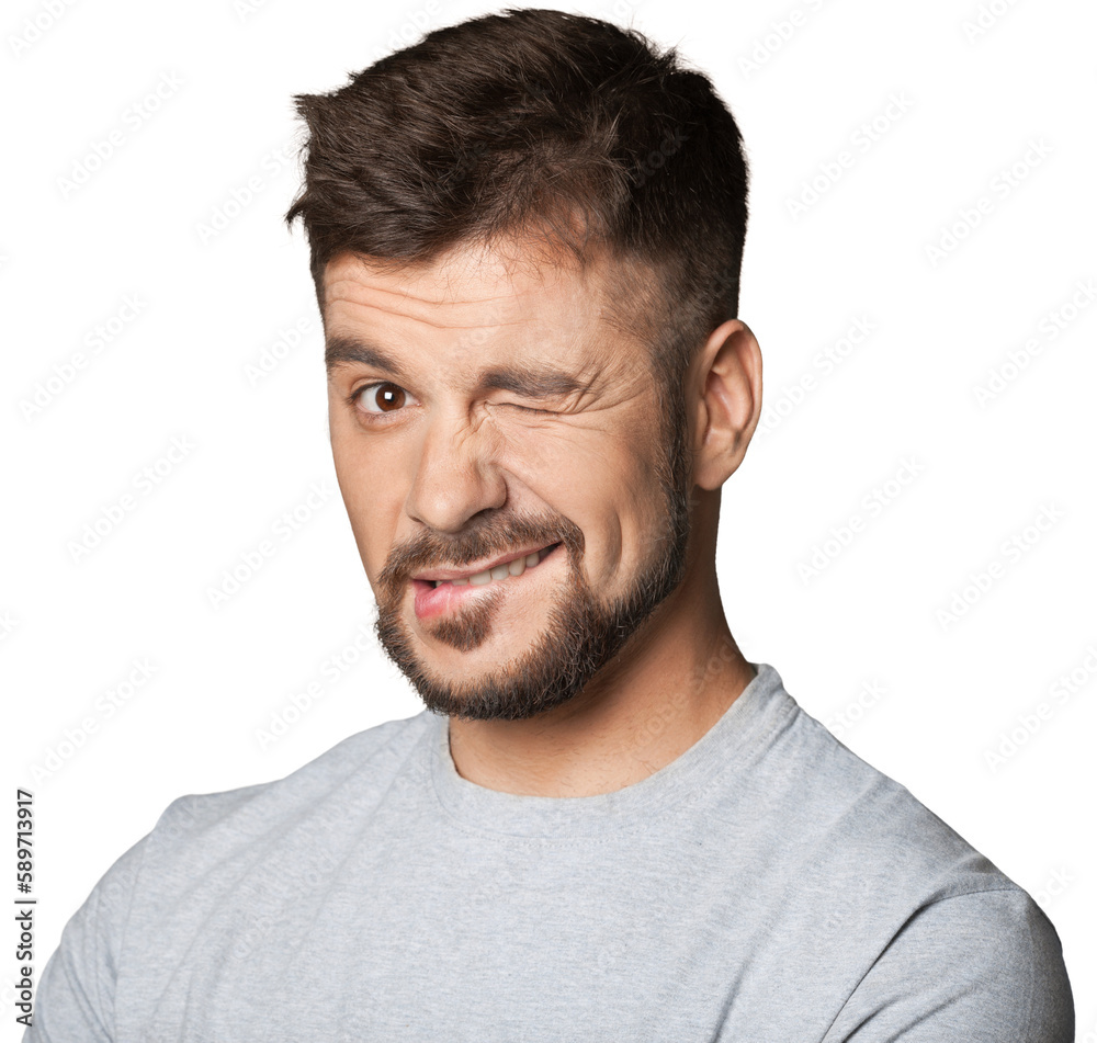 Young man winking an eye on background Young man winking an eye on background