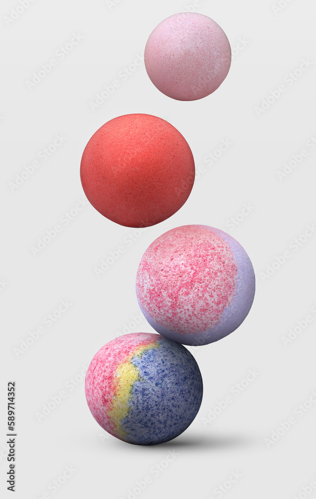 Many different bath bombs falling on white background Many different bath bombs falling on white background