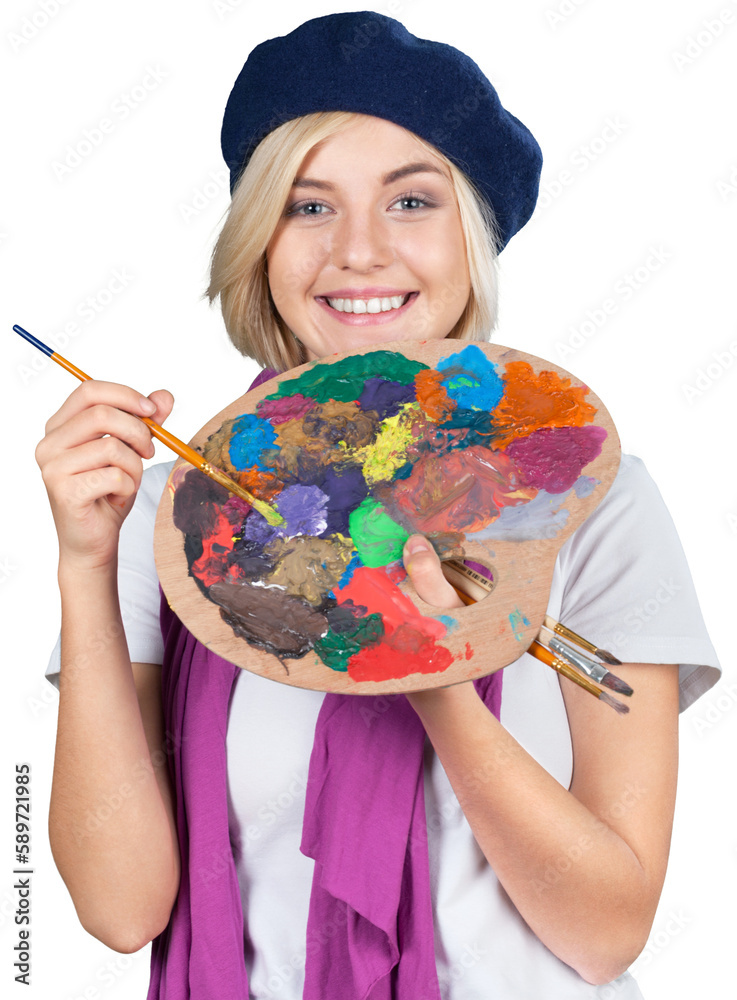 Fototapeta premium Young beautiful woman with palette and holding paintbrush while standing isolated against white background