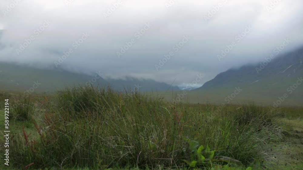 Pan left to right across moor land and misty highlands Pan left to right across moor land and misty highlands