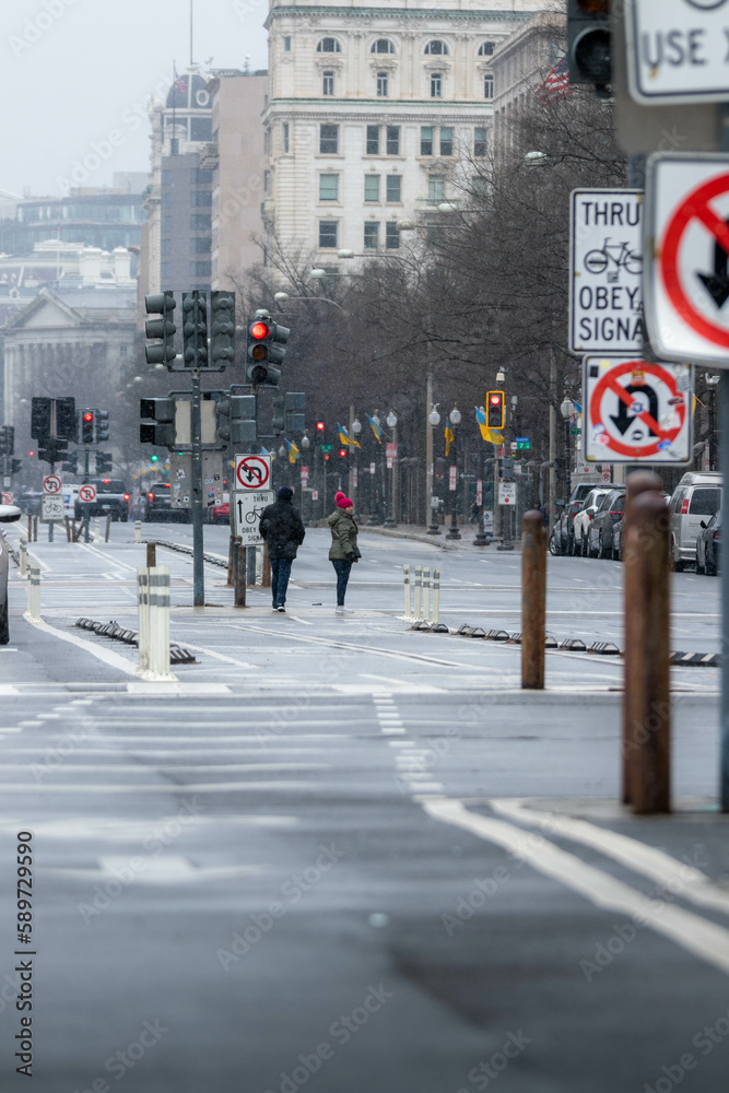 People Crossing the Street in Washington DC During a Snow Storm