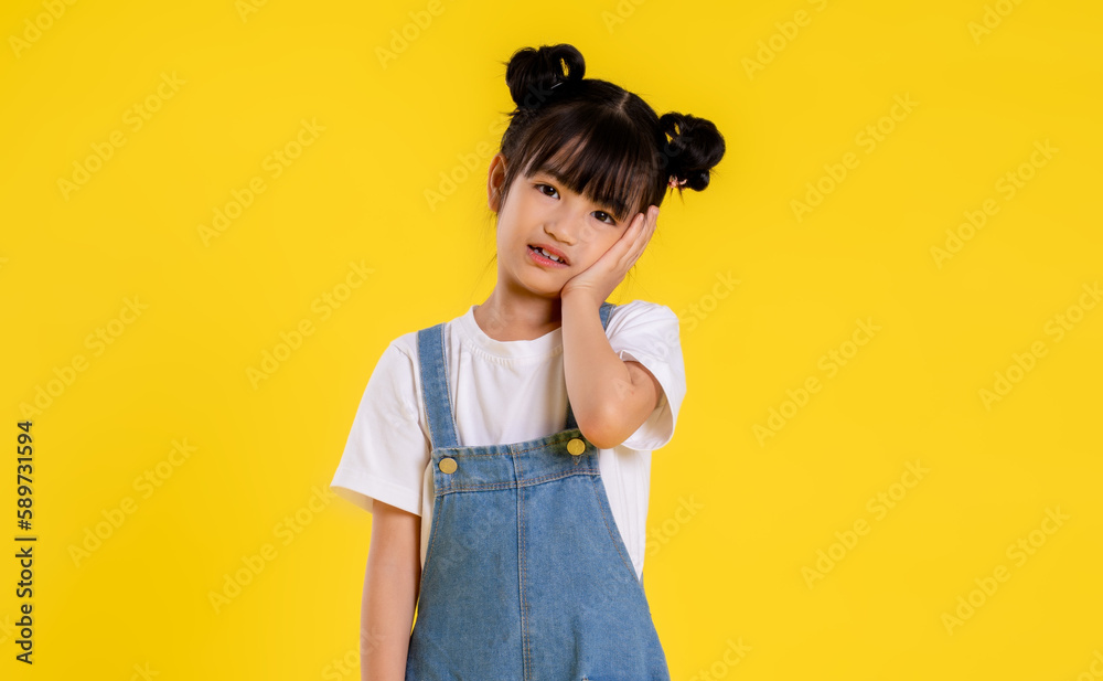 image  of  asian little girl posing on a yellow background