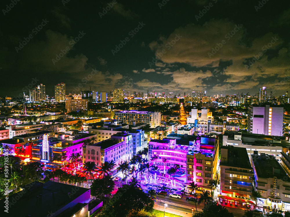 Fototapeta premium Ocean Drive in South Beach Miami Florida by drone at Night 4k