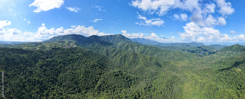 Fototapeta premium Landscape Panorama view, Beautiful landscape Green rice field In front of the mountain in sky clouds background.