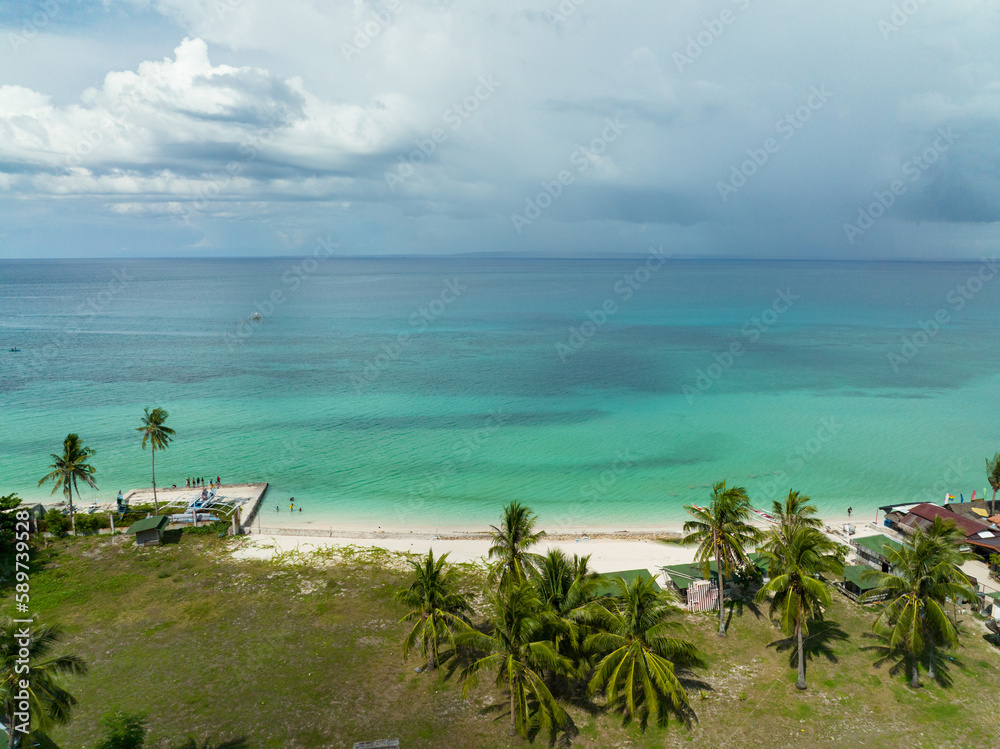 Naklejka premium Aerial drone of sandy beach and tropical island. Bantayan island, Philippines.