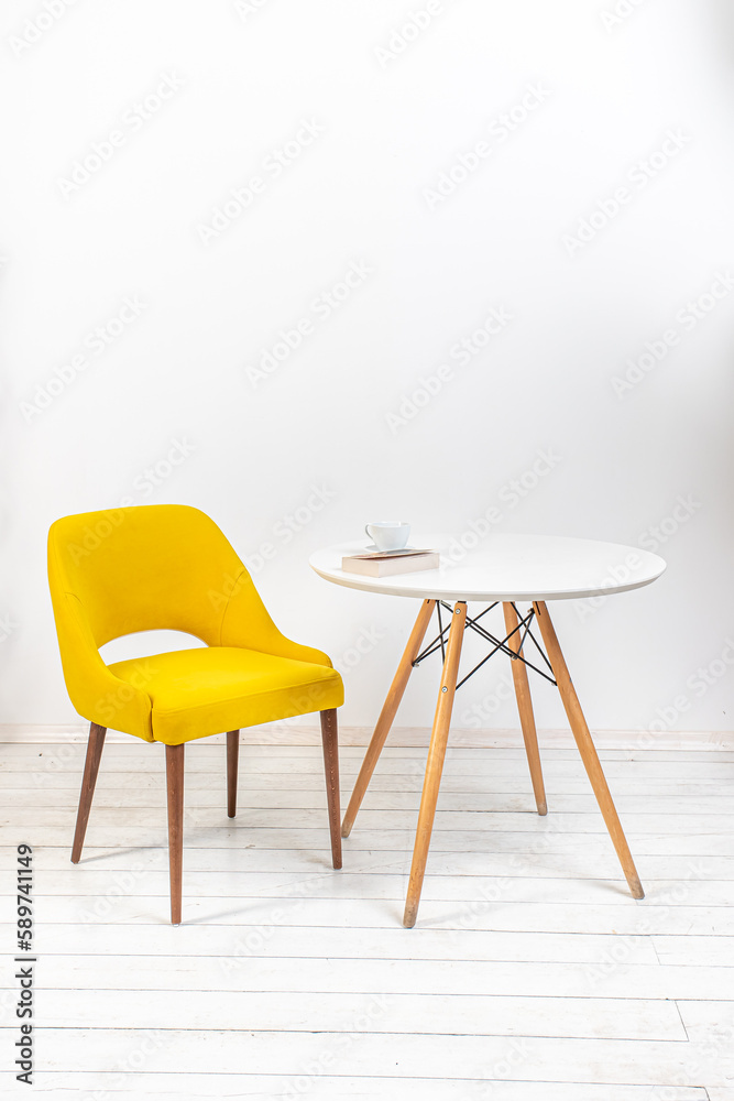 Obraz premium minimalistic interior, yellow armchair and white round table on white background