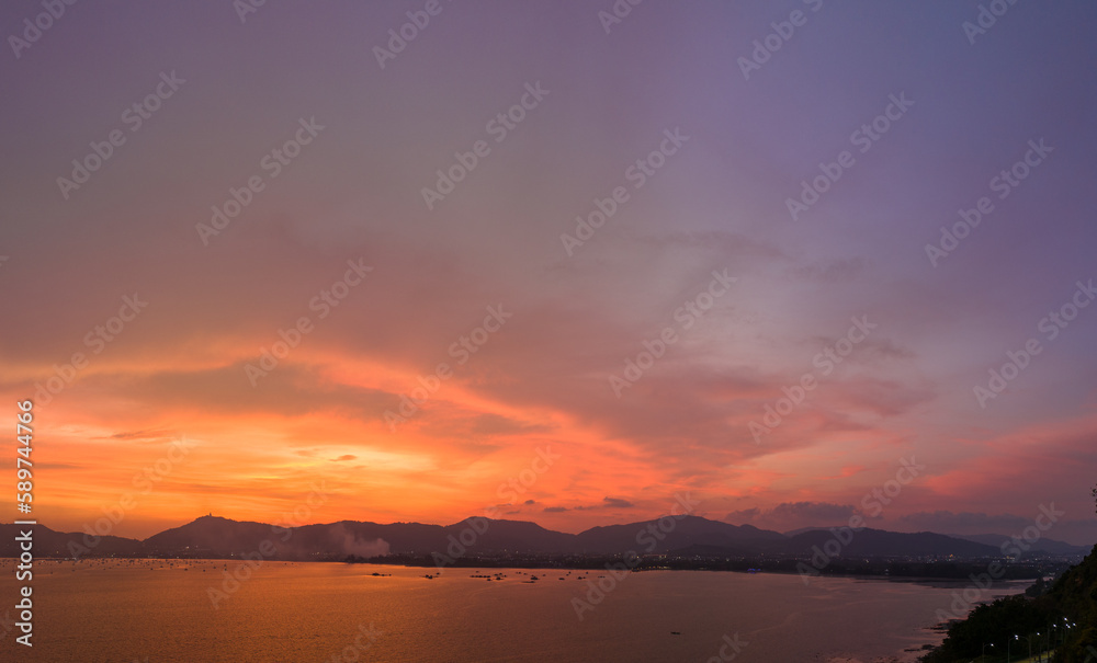 .aerial view stunning sky in sunset above the sea..colorful cloud in bright sky of sunset above the ocean at Khao Khad Phuket. .Majestic sunset or sunrise landscape Amazing ligh