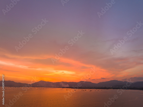 .aerial view stunning sky in sunset above the sea..colorful cloud in bright sky of sunset above the ocean at Khao Khad Phuket. .Majestic sunset or sunrise landscape Amazing ligh