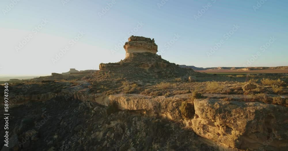 FPV aerial flying over rock formations at sunset in the stunning landscape of the Monegros Desert in Spain. FPV aerial flying over rock formations at sunset in the stunning landscape of the Monegros Desert in Spain.