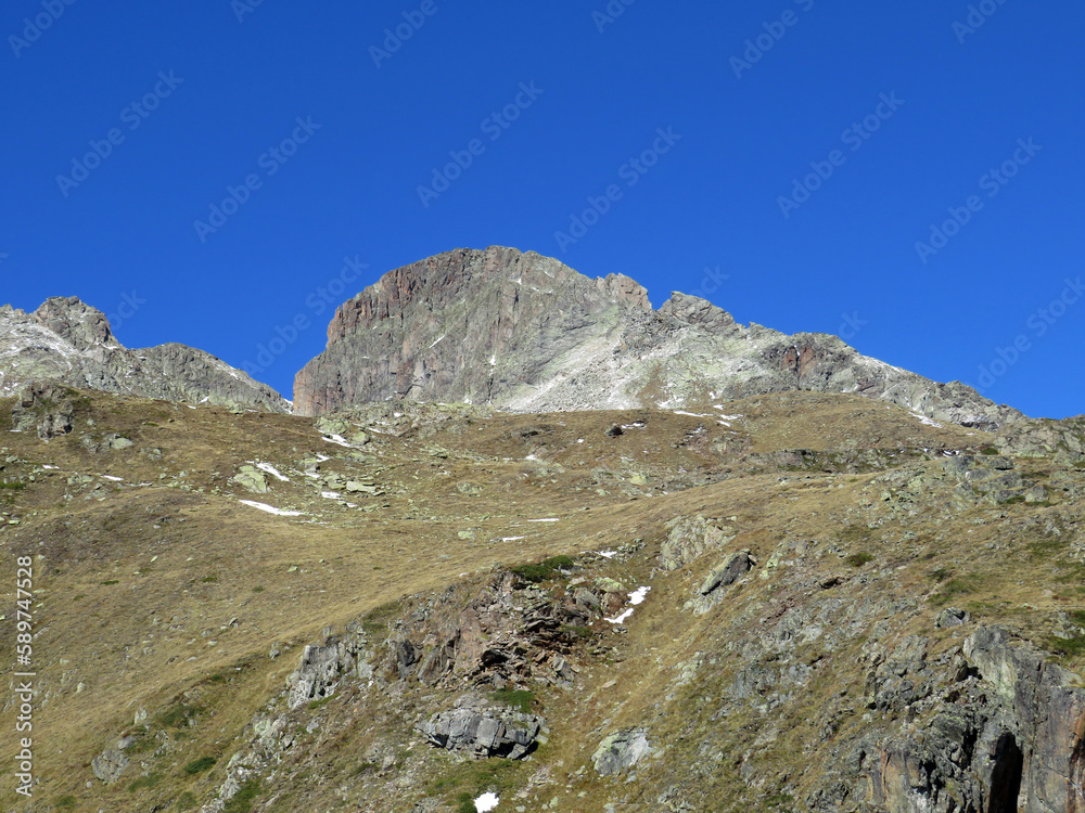 Rocky mountain peak Piz Radönt or Piz Radoent (3064 m) in the Albula Alps and above the alpine valley Val Grialetsch, Zernez - Canton of Grisons, Switzerland (Kanton Graubünden, Schweiz)