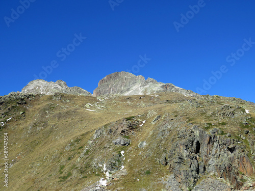 Rocky mountain peak Piz Radönt or Piz Radoent (3064 m) in the Albula Alps and above the alpine valley Val Grialetsch, Zernez - Canton of Grisons, Switzerland (Kanton Graubünden, Schweiz)