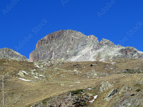 Rocky mountain peak Piz Radönt or Piz Radoent (3064 m) in the Albula Alps and above the alpine valley Val Grialetsch, Zernez - Canton of Grisons, Switzerland (Kanton Graubünden, Schweiz)