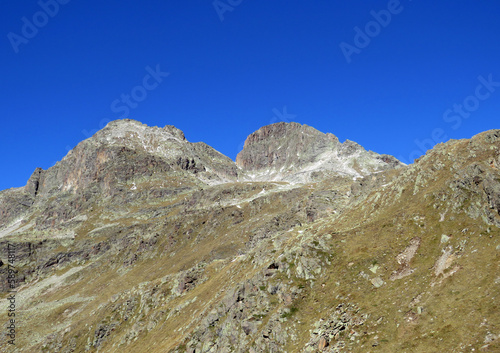 Rocky mountain peak Piz Radönt or Piz Radoent (3064 m) in the Albula Alps and above the alpine valley Val Grialetsch, Zernez - Canton of Grisons, Switzerland (Kanton Graubünden, Schweiz)
