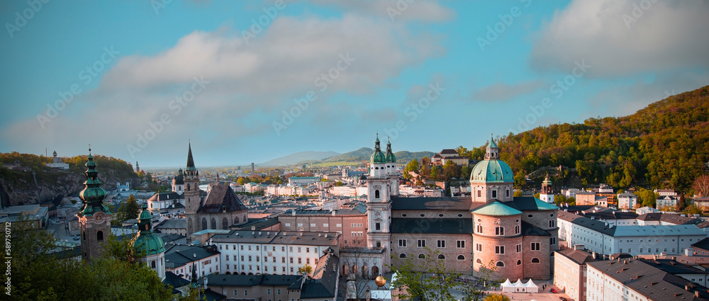  Panoramic view in a Autumn season at a historic city of Salzburg with Salzach river in beautiful golden evening light sky and colorful of autumn at sunset, Salzburger Land, Austria