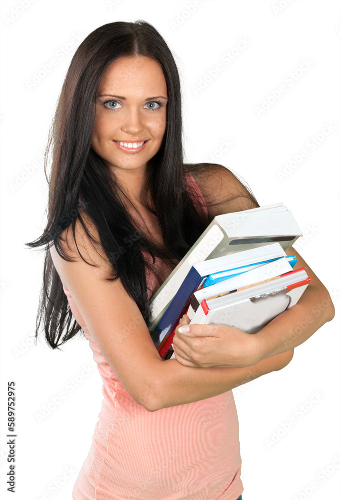Close up portrait of beautiful girl holding books and looking at camera on a white background Close up portrait of beautiful girl holding books and looking at camera on a white background