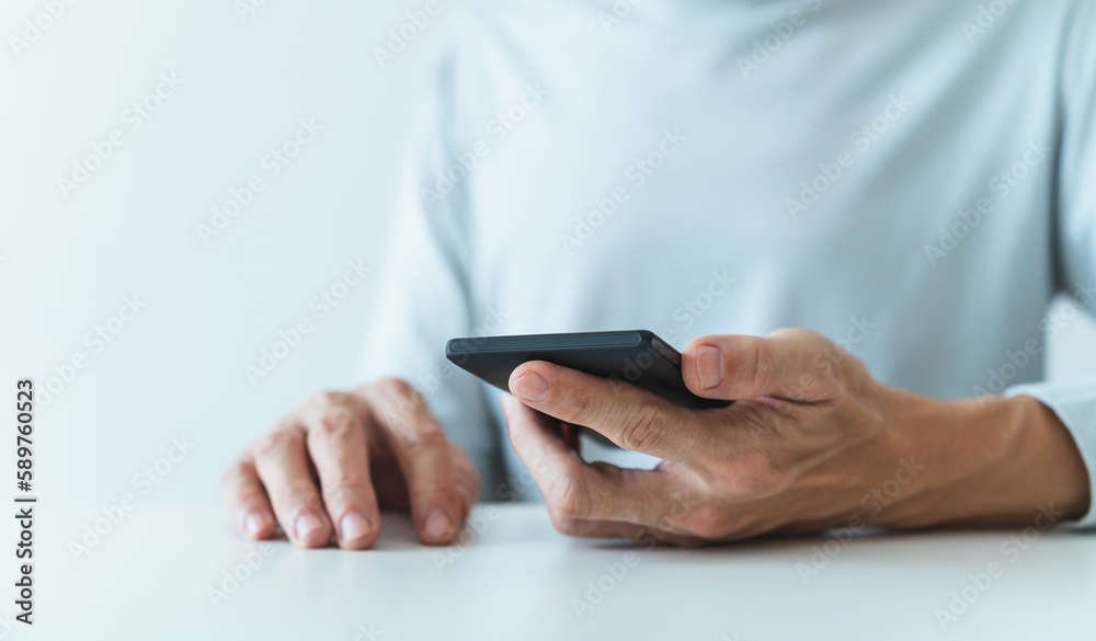 Man using social media application on smartphone for video, live streaming, meeting or conference online. Modern entertainment lifestyle and leisure via cyberspace technology like music and chat Man using social media application on smartphone for video, live streaming, meeting or conference online. Modern entertainment lifestyle and leisure via cyberspace technology like music and chat
