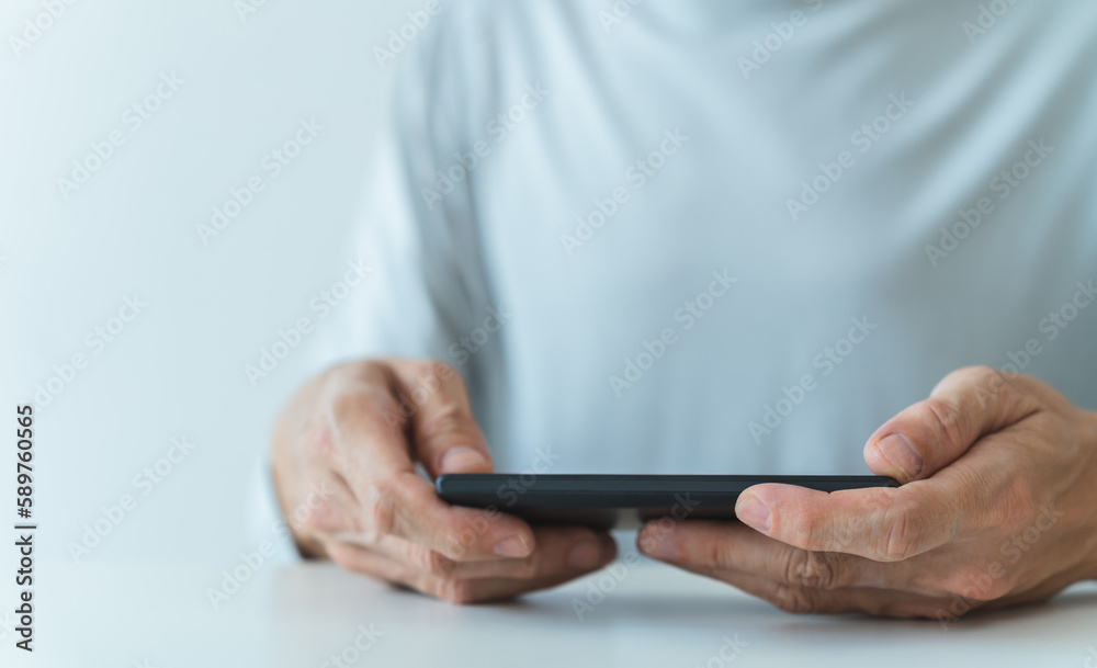 Man using social media application on smartphone for video, live streaming, meeting or conference online. Modern entertainment lifestyle and leisure via cyberspace technology like music and chat Man using social media application on smartphone for video, live streaming, meeting or conference online. Modern entertainment lifestyle and leisure via cyberspace technology like music and chat