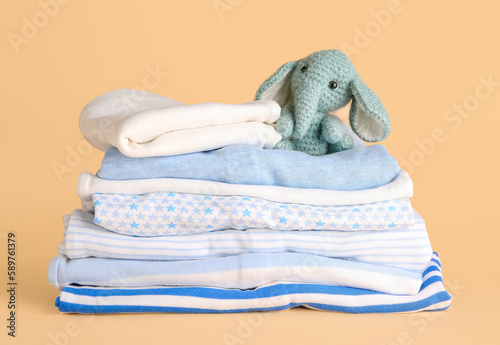 Stack of different baby clo...