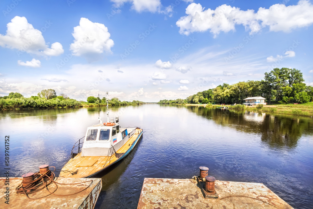 Summer landscape on the Klyazma River and a boat at the pier, Gorokhovets