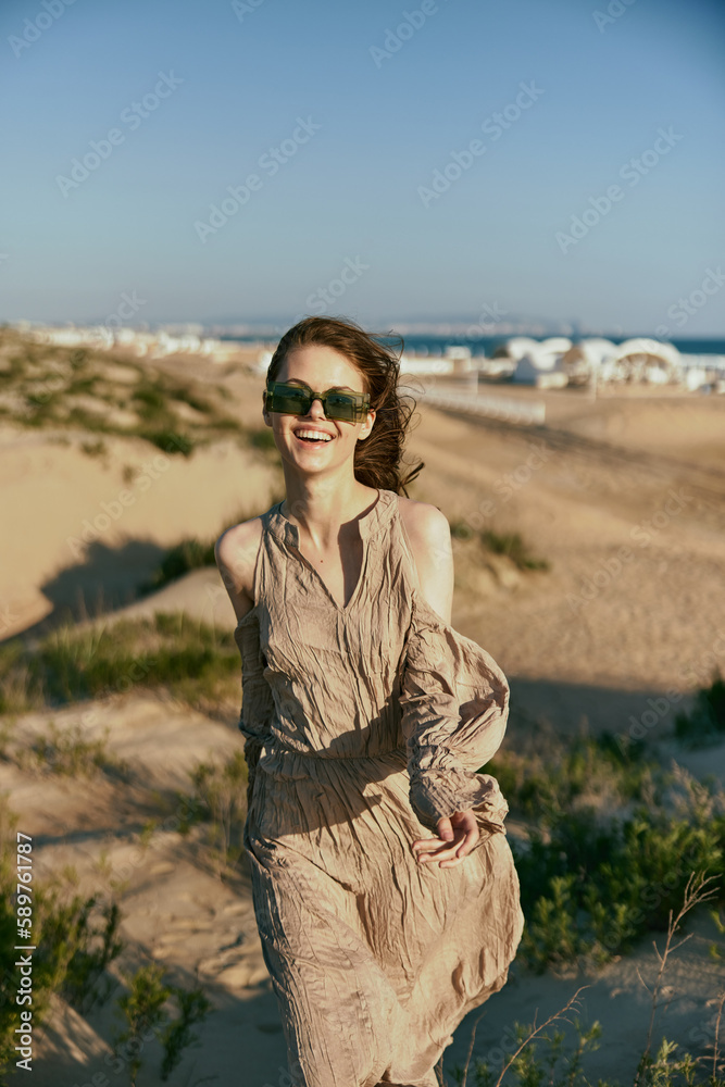 happy woman in sunglasses on vacation near the sea. Vacation, recovery, enjoyment happy woman in sunglasses on vacation near the sea. Vacation, recovery, enjoyment