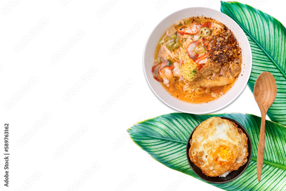 Spicy pork noodle soup with rice and fried egg on green leave with space on white background, Asian food background, egg noodle with clear soup
