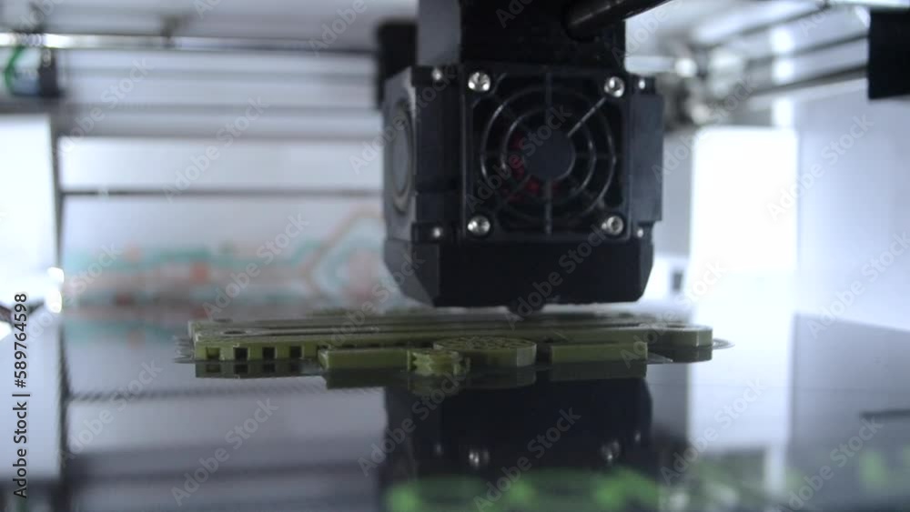 3D printer. Working 3d printer close-up. 3d printer printing object from molten plastic. Printing prototype. New modern printing technology on 3D printer. Additive progressive technologies. FDM 3D printer. Working 3d printer close-up. 3d printer printing object from molten plastic. Printing prototype. New modern printing technology on 3D printer. Additive progressive technologies. FDM