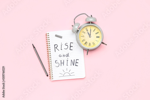 Notebook with text RISE AND...