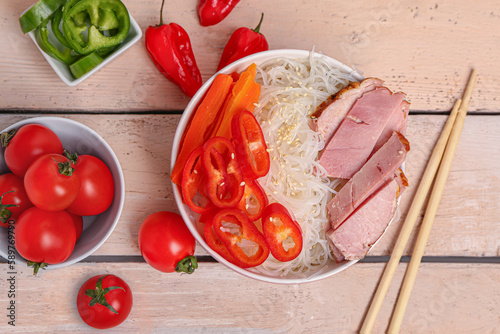 Rice noodle bowl with slice...