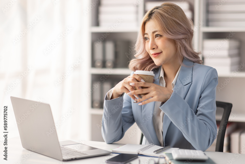Cheerful Young Asian Woman Employee Working Remotely At Office With Cellphone And Laptop,
Cheerful Young Asian Woman Employee Working Remotely At Office With Cellphone And Laptop,