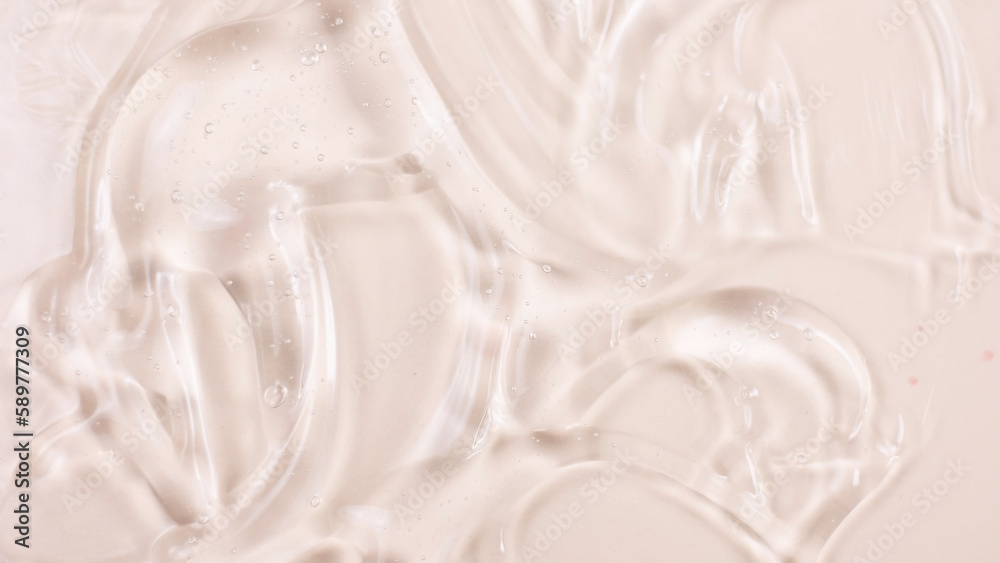 Beauty serum gel texture. Pink clear skincare cream with bubbles background. Transparent colored cosmetic product close up Beauty serum gel texture. Pink clear skincare cream with bubbles background. Transparent colored cosmetic product close up
