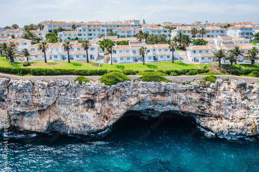Hotel on a rocky seashore.